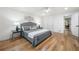 Well-lit bedroom features hardwood floors and ample space for a king-size bed at 3710 Country Estate Dr Nw, Kennesaw, GA 30152