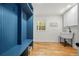 Modern mud room features coat rack, storage, sink and hardwood flooring at 3710 Country Estate Dr Nw, Kennesaw, GA 30152
