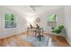 Bright office space with hardwood floors, two windows, and stylish decor at 3710 Country Estate Dr Nw, Kennesaw, GA 30152
