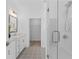 Well-lit bathroom with double vanity, stylish floors, and modern shower at 388 Pratt Dr # 2113, Atlanta, GA 30315