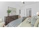 Bedroom with a sleek dresser, bright lighting, and comfortable bedding at 388 Pratt Dr # 2113, Atlanta, GA 30315