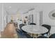Open kitchen features stainless appliances, island with seating and modern pendant lighting at 388 Pratt Dr # 2113, Atlanta, GA 30315