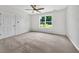 Spacious bedroom featuring neutral carpet and a window that provides natural light at 256 Prometheous Way, Rockmart, GA 30153
