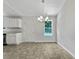 Cozy dining area with stylish chandelier and window with a view of nature at 256 Prometheous Way, Rockmart, GA 30153