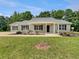 Charming ranch-style home with manicured lawn and landscaping, offering great curb appeal at 256 Prometheous Way, Rockmart, GA 30153