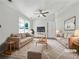 Bright living room featuring neutral tones, plush rug, and comfortable furnishings for relaxation at 256 Prometheous Way, Rockmart, GA 30153