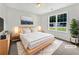 Cozy main bedroom with modern decor, natural light, and ample space for relaxation at 256 Prometheous Way, Rockmart, GA 30153