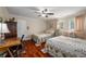 Bright bedroom with hardwood floors, ceiling fan, and closet at 2610 Links End, Roswell, GA 30076