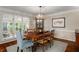 Elegant dining room with a classic table and chairs, hardwood floors, and natural light at 2610 Links End, Roswell, GA 30076