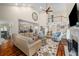 Spacious living room with high ceilings, a fireplace, hardwood floors, and plenty of natural light at 2610 Links End, Roswell, GA 30076