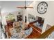 Sunlit living room features hardwood floors, a soaring ceiling, and large windows at 2610 Links End, Roswell, GA 30076