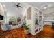 Open-concept living area with vaulted ceilings and hardwood floors, showcasing seamless flow to the kitchen at 2610 Links End, Roswell, GA 30076