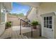 Inviting patio features rocking chair, lush potted plants, and charming lattice detail at 2610 Links End, Roswell, GA 30076