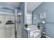 Bathroom featuring tub with a shower head and a glass door at 3064 Baymount Way, Lawrenceville, GA 30043