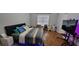 Comfortable bedroom featuring hardwood floors, a cozy bed, and modern décor at 3064 Baymount Way, Lawrenceville, GA 30043