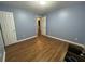 Bedroom with laminate floors, neutral walls, and closet doors at 3064 Baymount Way, Lawrenceville, GA 30043