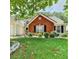 Charming home featuring a brick facade and well-maintained landscaping at 3064 Baymount Way, Lawrenceville, GA 30043