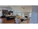 Open concept living space with kitchen island, cozy seating, and fireplace at 3064 Baymount Way, Lawrenceville, GA 30043