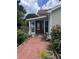 Charming home featuring a beautiful front door with decorative glass and a quaint, flower-lined walkway at 702 Moon Rd, Lawrenceville, GA 30046