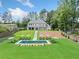 Stunning backyard with a large pool and lounge chairs, perfect for outdoor relaxation and entertaining at 103 Maddox Rd, Buford, GA 30518