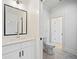 Clean bathroom with a white vanity, framed mirror, and hexagon-tiled floor at 103 Maddox Rd, Buford, GA 30518