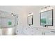 Bathroom featuring marble floors, double sinks, black fixtures, white cabinets and view into bedroom at 103 Maddox Rd, Buford, GA 30518