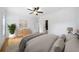 Stylishly furnished bedroom with hardwood floors, natural lighting, and views of the surrounding landscape at 103 Maddox Rd, Buford, GA 30518