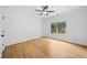 Sunlit bedroom with hardwood floors and large window at 103 Maddox Rd, Buford, GA 30518