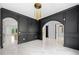 Open concept dining room with black accents, marble flooring, and seamless flow into the kitchen at 103 Maddox Rd, Buford, GA 30518