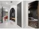Bright entryway with marble floors, coat rack, and a glimpse into a garage with a luxury sports car at 103 Maddox Rd, Buford, GA 30518
