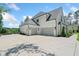 Spacious three-car garage with a large driveway and ample parking space at 103 Maddox Rd, Buford, GA 30518