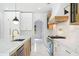 Gourmet kitchen featuring marble countertops, state-of-the-art appliances, and designer fixtures at 103 Maddox Rd, Buford, GA 30518
