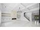 Open living space with a fireplace, custom cabinetry, elegant lighting, and staircase to the second floor at 103 Maddox Rd, Buford, GA 30518
