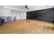 Open living room featuring a kitchenette and wood floors at 103 Maddox Rd, Buford, GA 30518