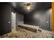Dark living room with built-in seating and walk-in closet with custom shelving at 103 Maddox Rd, Buford, GA 30518