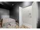 Dark living room with built-in seating, stairs and closet with custom shelving at 103 Maddox Rd, Buford, GA 30518