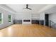 Spacious living room with hardwood floors, fireplace, custom cabinets and plenty of natural light at 103 Maddox Rd, Buford, GA 30518