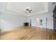 Expansive main bedroom with tray ceiling, hardwood floors, and a connected bathroom and walk-in closet at 103 Maddox Rd, Buford, GA 30518