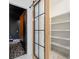 Spacious pantry adjacent to a sliding glass door and a dark accent room at 103 Maddox Rd, Buford, GA 30518