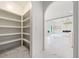 Walk-in pantry with ample shelving space and marble floors located near a large living area at 103 Maddox Rd, Buford, GA 30518