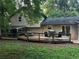 Lovely home features a large deck area perfect for entertaining friends and Gathering with screened porch and lush backyard at 3474 Leaf Land Ct, Duluth, GA 30097