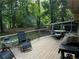 Outdoor deck with grill and seating area, ideal for entertaining at 3474 Leaf Land Ct, Duluth, GA 30097