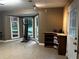 Inviting living room with tiled flooring, bay windows and natural light, offering a comfortable atmosphere at 3474 Leaf Land Ct, Duluth, GA 30097