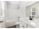 Bathroom featuring shower-tub combination, single sink vanity, white countertops, and dark hardware at 4778 Moonstone Trce, Kennesaw, GA 30144