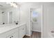 Bright bathroom featuring a double sink vanity with a white countertop and dark hardware at 4778 Moonstone Trce, Kennesaw, GA 30144