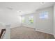Spacious bedroom featuring neutral carpet, natural light from multiple windows, and ample space at 4778 Moonstone Trce, Kennesaw, GA 30144