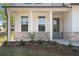 Charming front porch with brick accents, columns, and manicured landscaping at 4778 Moonstone Trce, Kennesaw, GA 30144
