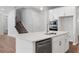 Bright kitchen with white cabinets, quartz countertop island, and stainless steel appliances at 4778 Moonstone Trce, Kennesaw, GA 30144