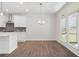 Bright kitchen view features a kitchen island and access to a patio area at 4778 Moonstone Trce, Kennesaw, GA 30144