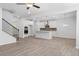Open-concept floor plan featuring a living room and kitchen with lots of natural light and hardwood floors at 4778 Moonstone Trce, Kennesaw, GA 30144